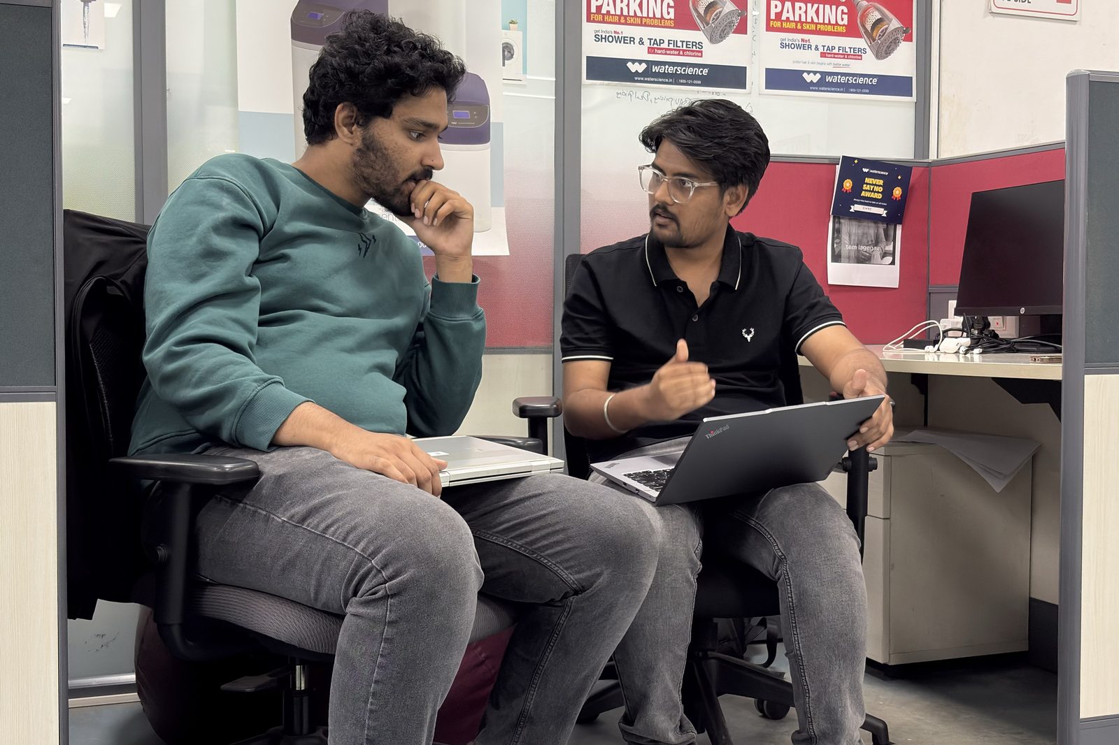 WaterScience colleagues collaborating at a laptop