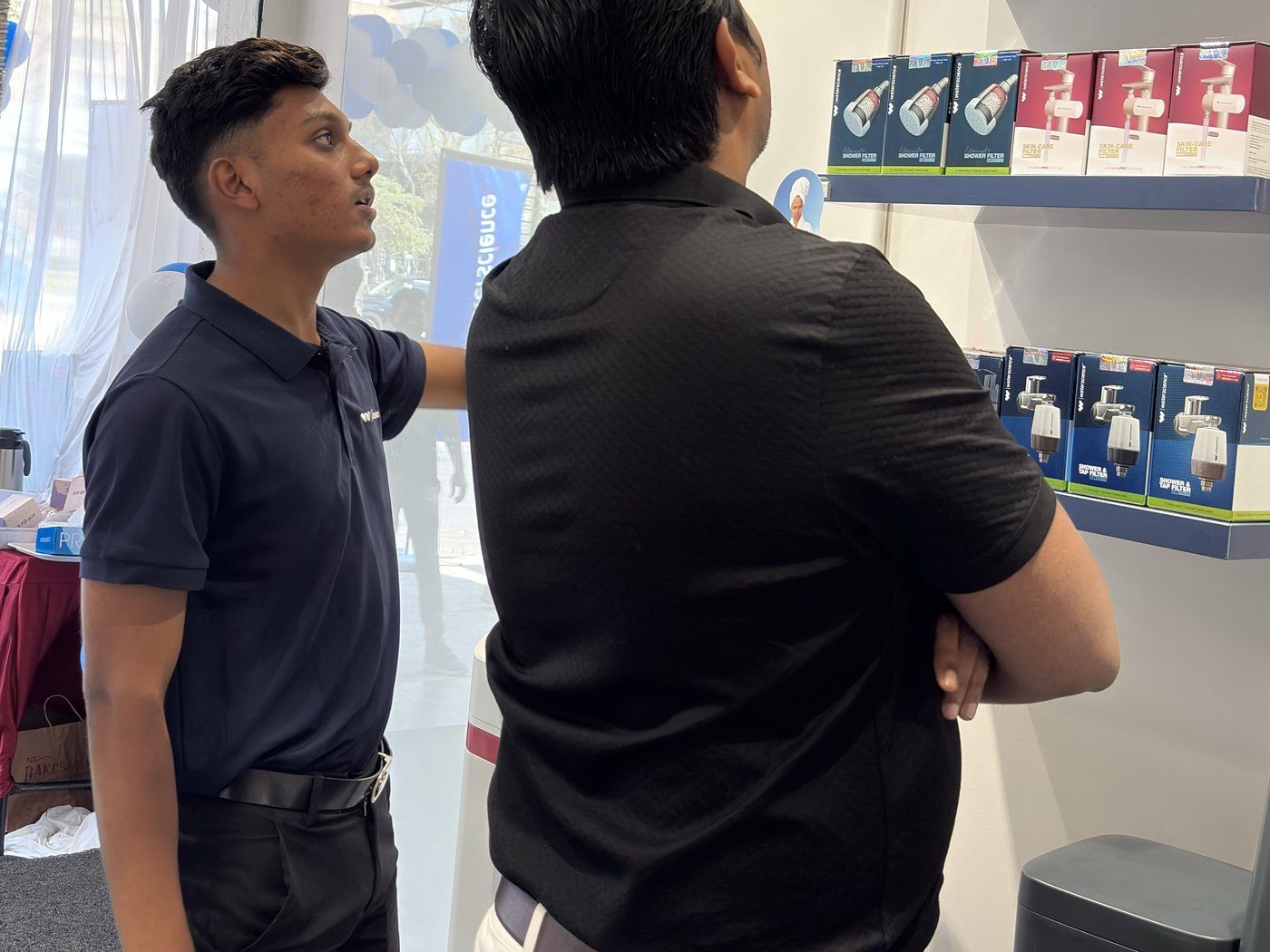 Customers exploring products in a WaterScience experience store