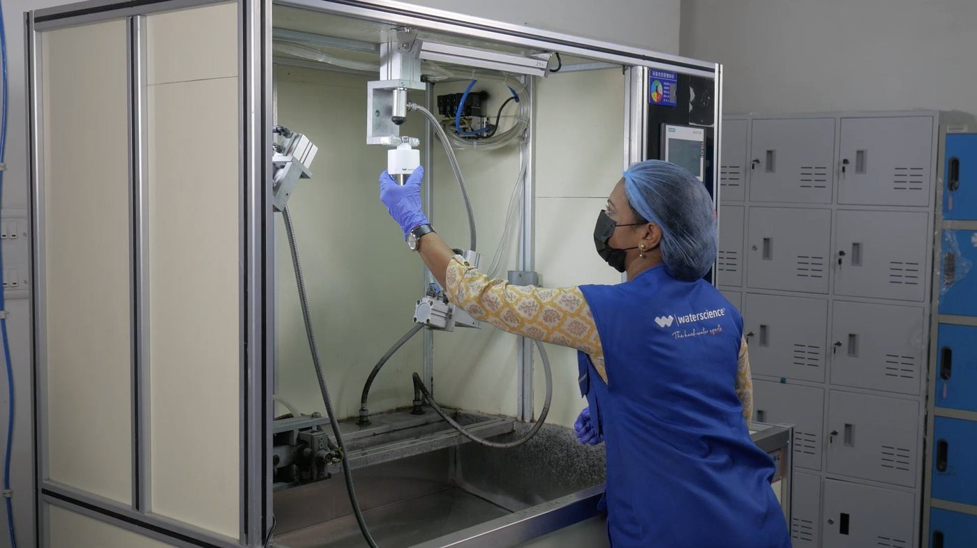 WaterScience team member working at a testing station